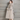 Manteau ample à capuche en fausse fourrure