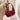 Bolso de mano de cuero verni en forma de media luna con bandolera ajustable y bolsillos con cremallera